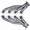 A pair of stainless steel headers with white rubber pads.