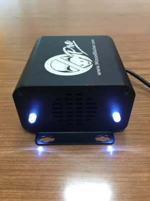 A black box with two blue lights on top of it.