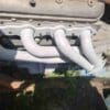 A close up of the exhaust pipes on an engine